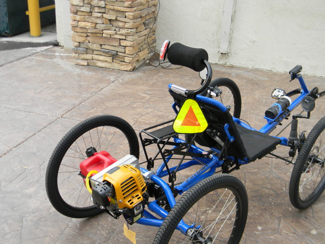 Be Seen From Behind - On the rear of the bike we've not only attached a Reflective Yield Symbol to increase visibility, but we've also put Cateye 5 LED Tail lights on the headrest and Planet Bike Super Flash LED Light on the gas can.